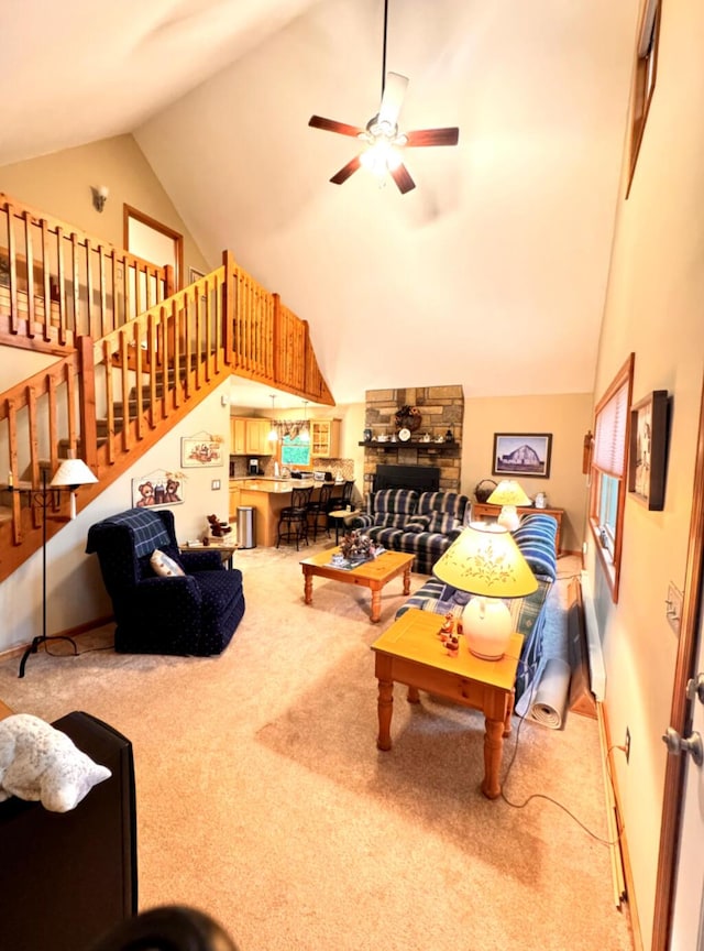 155 Clifton Dr, Bushkill, PA 18324 - carpeted living area featuring a ceiling fan, stairway, and high vaulted ceiling