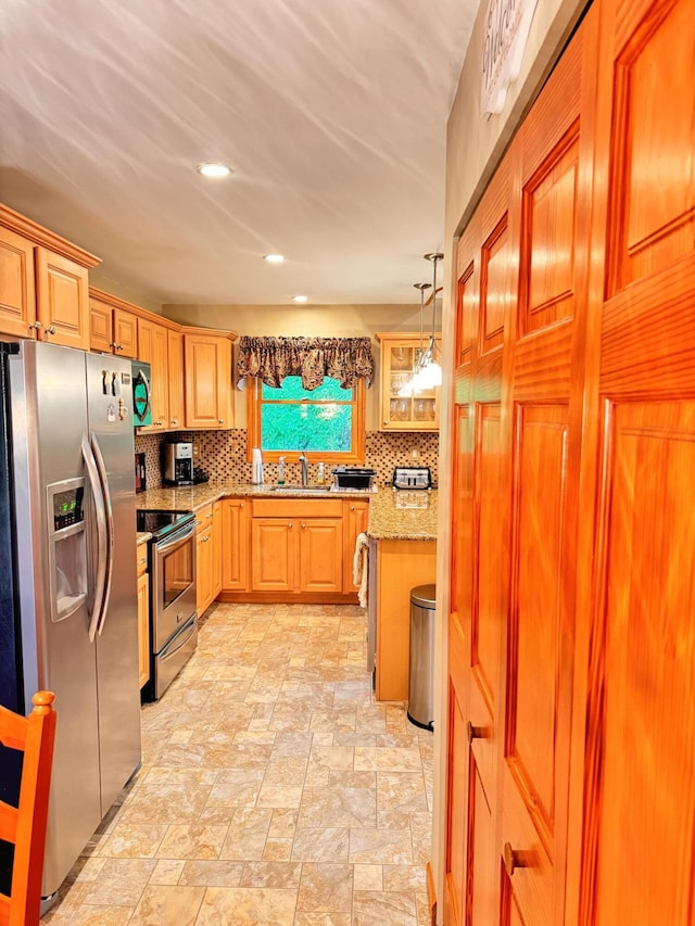 155 Clifton Dr, Bushkill, PA 18324 - kitchen featuring appliances with stainless steel finishes, a sink, tasteful backsplash, light stone countertops, and recessed lighting