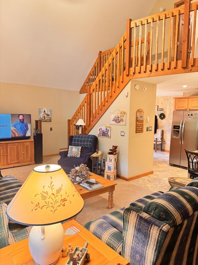155 Clifton Dr, Bushkill, PA 18324 - living room with stairs, light carpet, high vaulted ceiling, and baseboards