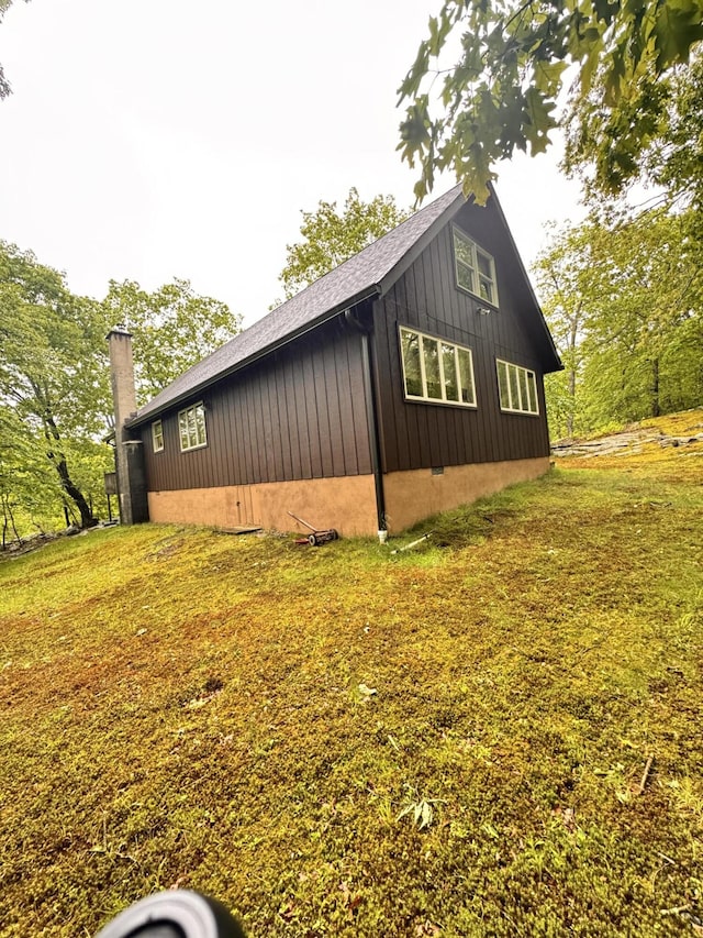 155 Clifton Dr, Bushkill, PA 18324 - view of side of home featuring board and batten siding and a shingled roof