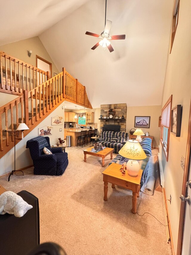 155 Clifton Dr, Bushkill, PA 18324 - carpeted living room with high vaulted ceiling, ceiling fan, and stairway
