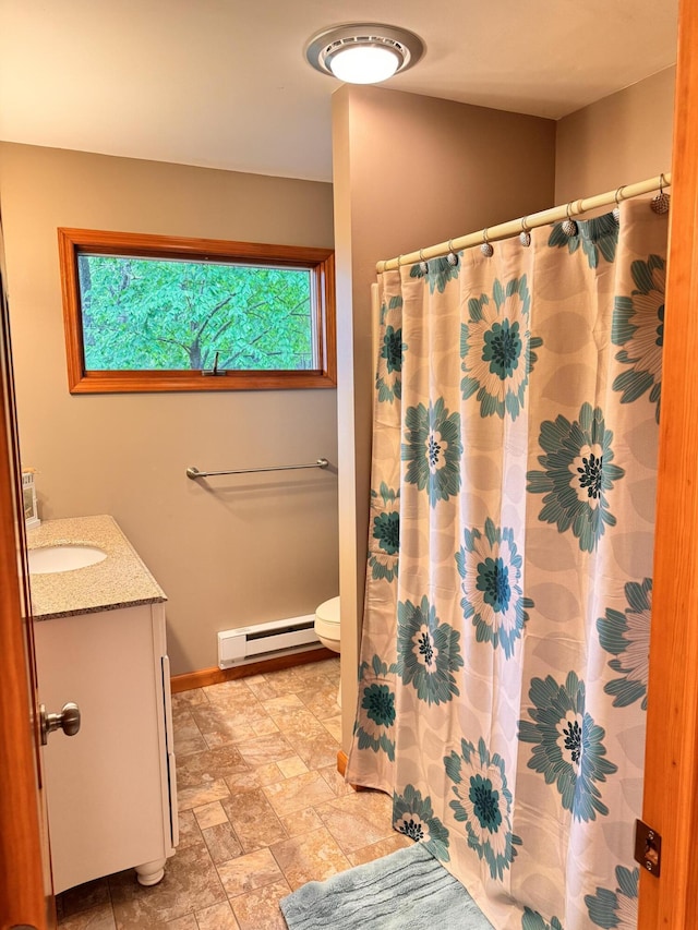 155 Clifton Dr, Bushkill, PA 18324 - bathroom featuring a baseboard heating unit, vanity, toilet, baseboards, and a shower with shower curtain