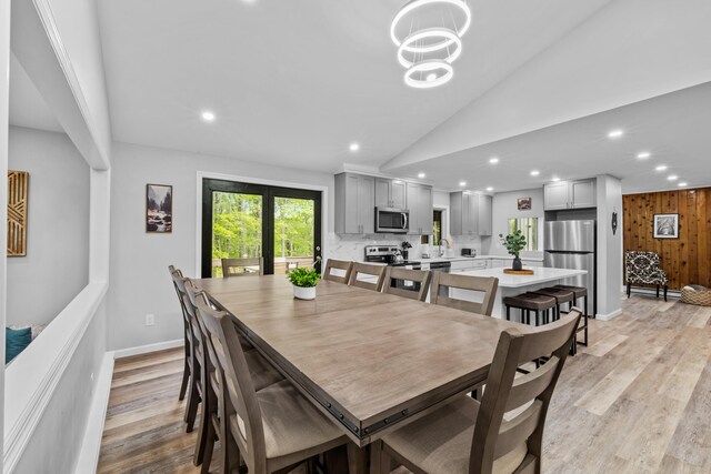 181 Williams Ln, Scotrun, PA 18355 - dining space with light wood-style floors, lofted ceiling, recessed lighting, and a chandelier