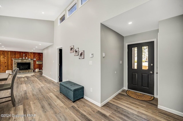 181 Williams Ln, Scotrun, PA 18355 - entryway featuring wood finished floors, baseboards, recessed lighting, a stone fireplace, and a high ceiling