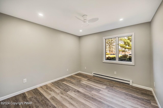 181 Williams Ln, Scotrun, PA 18355 - empty room featuring a baseboard heating unit, wood finished floors, baseboards, and recessed lighting