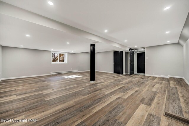 181 Williams Ln, Scotrun, PA 18355 - basement with a baseboard heating unit, wood finished floors, baseboards, and recessed lighting