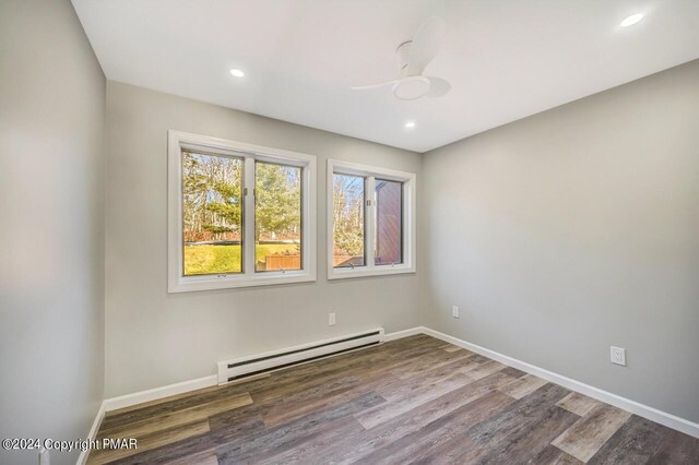 181 Williams Ln, Scotrun, PA 18355 - empty room with baseboard heating, wood finished floors, a ceiling fan, baseboards, and recessed lighting