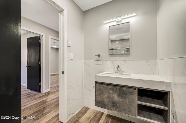 181 Williams Ln, Scotrun, PA 18355 - bathroom featuring tile walls, wood finished floors, a wainscoted wall, and vanity