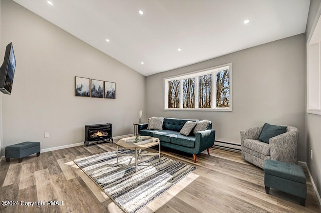 181 Williams Ln, Scotrun, PA 18355 - living area with light wood-style floors, recessed lighting, baseboards, lofted ceiling, and a baseboard radiator