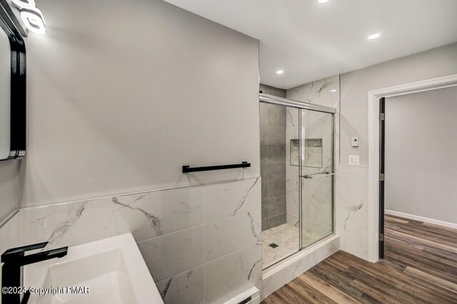 181 Williams Ln, Scotrun, PA 18355 - full bathroom with a marble finish shower, recessed lighting, wood finished floors, a sink, and wainscoting