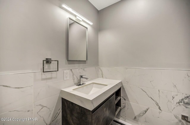 181 Williams Ln, Scotrun, PA 18355 - bathroom featuring wainscoting, vanity, and tile walls