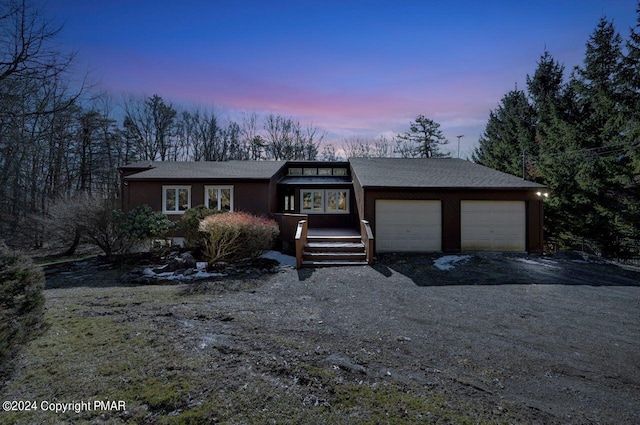 181 Williams Ln, Scotrun, PA 18355 - mid-century modern home featuring driveway, a garage, and a shingled roof