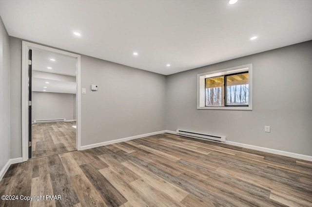 181 Williams Ln, Scotrun, PA 18355 - empty room featuring a baseboard radiator, wood finished floors, baseboards, and recessed lighting
