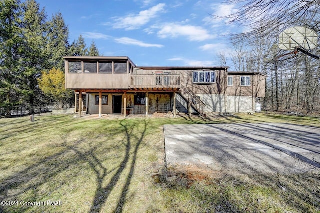 181 Williams Ln, Scotrun, PA 18355 - rear view of house with a sunroom, a lawn, a deck, stairs, and a patio area
