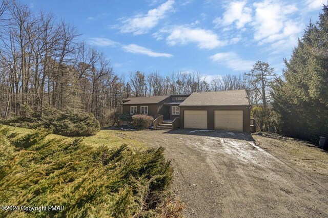 181 Williams Ln, Scotrun, PA 18355 - view of front of home with dirt driveway and a garage