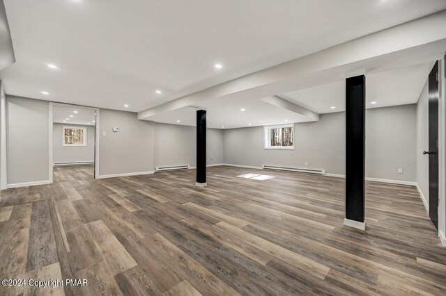 181 Williams Ln, Scotrun, PA 18355 - below grade area with a baseboard radiator, wood finished floors, baseboards, and recessed lighting