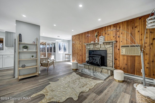 181 Williams Ln, Scotrun, PA 18355 - living room featuring wood walls, wood finished floors, recessed lighting, a fireplace, and baseboard heating