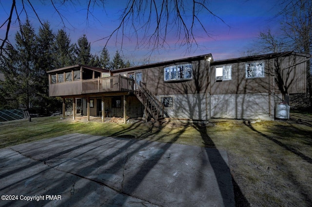 181 Williams Ln, Scotrun, PA 18355 - view of front facade featuring stairway, a wooden deck, and a yard