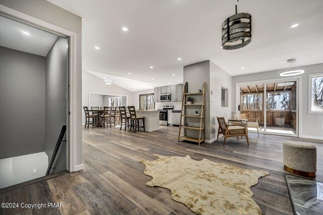 181 Williams Ln, Scotrun, PA 18355 - living area with dark wood finished floors, baseboards, recessed lighting, and lofted ceiling
