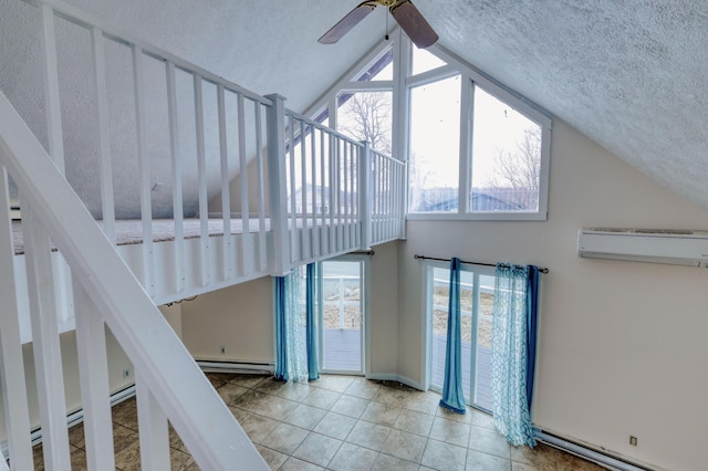 1452 Waterfront Dr, Tobyhanna, PA 18466 - stairs with a baseboard heating unit, a baseboard radiator, ceiling fan, an AC wall unit, and a textured ceiling