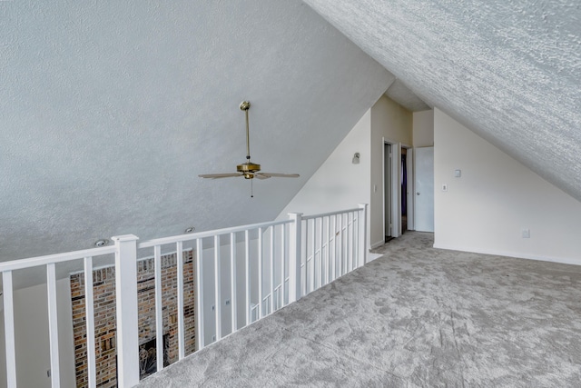 1452 Waterfront Dr, Tobyhanna, PA 18466 - additional living space featuring lofted ceiling, a ceiling fan, a textured ceiling, and carpet floors
