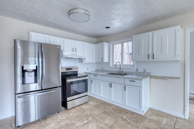 1452 Waterfront Dr, Tobyhanna, PA 18466 - kitchen with appliances with stainless steel finishes, a sink, under cabinet range hood, a textured ceiling, and white cabinets