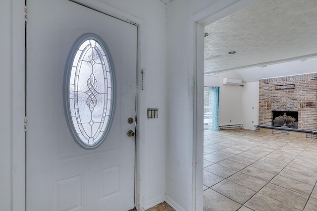 1452 Waterfront Dr, Tobyhanna, PA 18466 - foyer entrance featuring a textured ceiling, baseboard heating, a wall mounted air conditioner, a fireplace, and light tile patterned floors