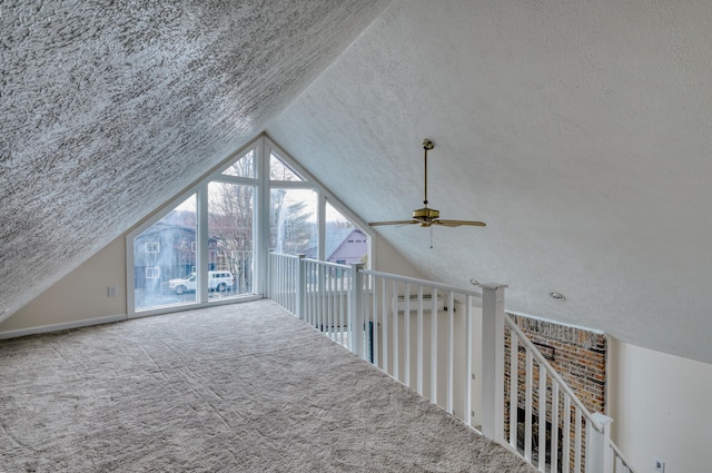 1452 Waterfront Dr, Tobyhanna, PA 18466 - bonus room featuring a textured ceiling, a ceiling fan, lofted ceiling, and carpet flooring