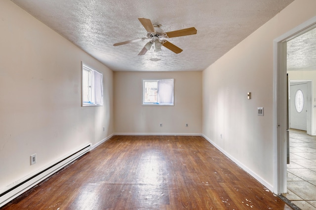 1452 Waterfront Dr, Tobyhanna, PA 18466 - unfurnished room with a baseboard heating unit, wood finished floors, a textured ceiling, ceiling fan, and baseboards