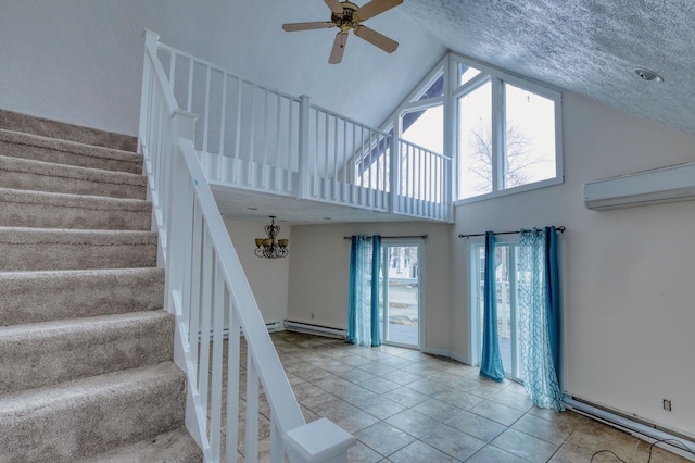 1452 Waterfront Dr, Tobyhanna, PA 18466 - staircase featuring a wall mounted AC, a baseboard radiator, ceiling fan, high vaulted ceiling, and tile patterned floors