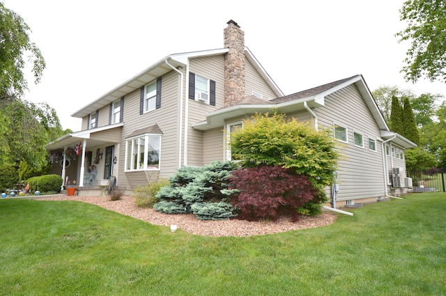 1618 Kickapoo Ter, Effort, PA 18330 - view of property exterior with a chimney, a lawn, cooling unit, and a porch