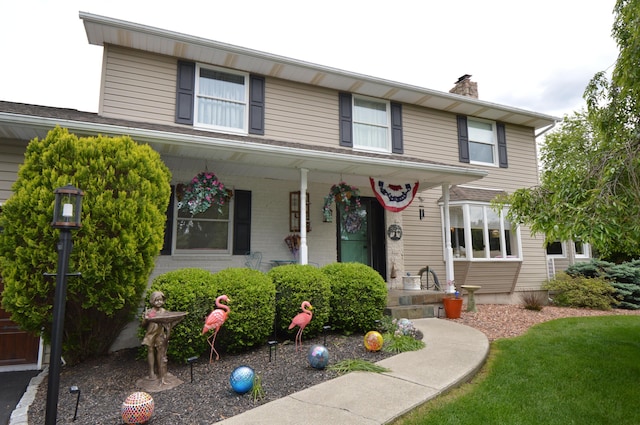 1618 Kickapoo Ter, Effort, PA 18330 - view of front facade featuring a porch and a chimney