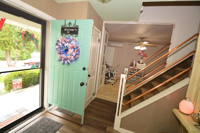 1618 Kickapoo Ter, Effort, PA 18330 - entrance foyer with stairs, dark wood-style floors, a ceiling fan, and an AC wall unit