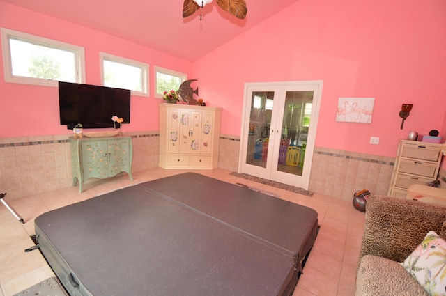 1618 Kickapoo Ter, Effort, PA 18330 - bedroom featuring tile walls, french doors, tile patterned floors, a wainscoted wall, and vaulted ceiling