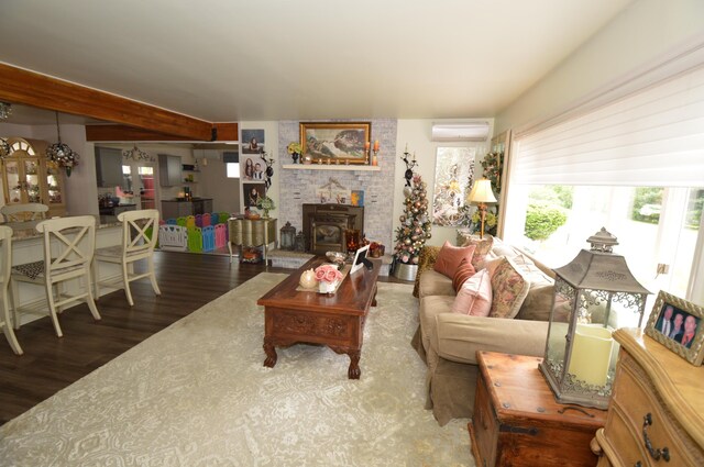 1618 Kickapoo Ter, Effort, PA 18330 - living room featuring a wall mounted air conditioner, wood finished floors, and beamed ceiling