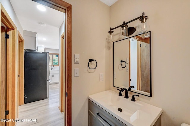 bathroom featuring vanity and wood finished floors