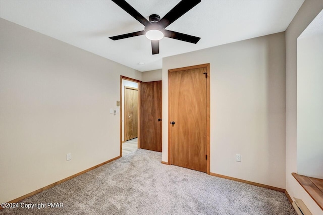 unfurnished bedroom with a closet, light carpet, ceiling fan, and baseboards