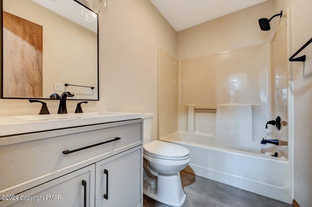 bathroom with toilet, vanity, and bathing tub / shower combination