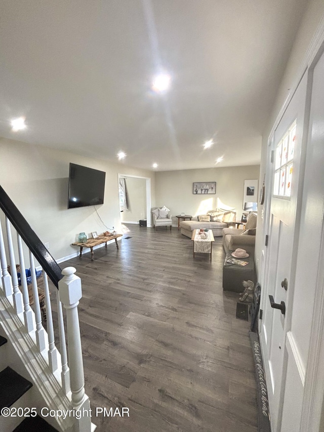 living room featuring stairs, wood finished floors, and recessed lighting