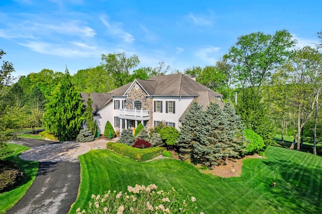 145 Rising Meadow Way E, Stroudsburg, PA 18302 - colonial home with stone siding and a balcony