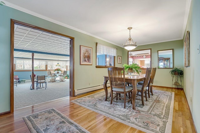 148 Summit Ave, Pocono Summit, PA 18346 - dining space with a wealth of natural light, light wood-type flooring, and a baseboard heating unit