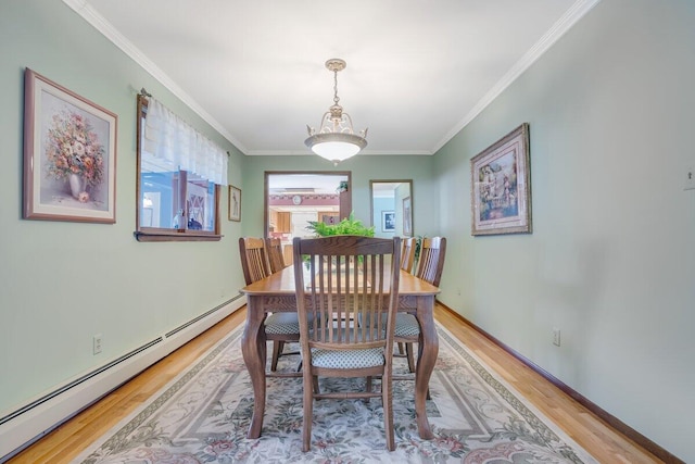 148 Summit Ave, Pocono Summit, PA 18346 - dining area featuring light wood-type flooring, crown molding, baseboards, and a baseboard radiator