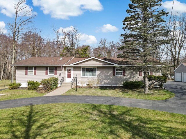 148 Summit Ave, Pocono Summit, PA 18346 - ranch-style house featuring a front yard, driveway, a garage, and a chimney
