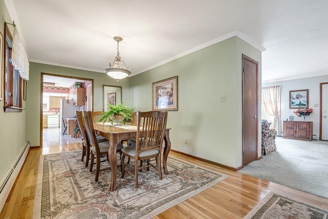 148 Summit Ave, Pocono Summit, PA 18346 - dining space with ornamental molding, a wealth of natural light, and a baseboard radiator