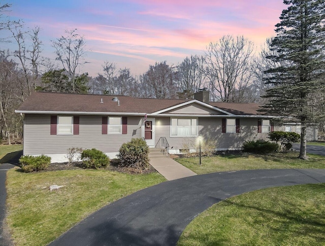 148 Summit Ave, Pocono Summit, PA 18346 - view of front of property with a lawn, a chimney, and a shingled roof