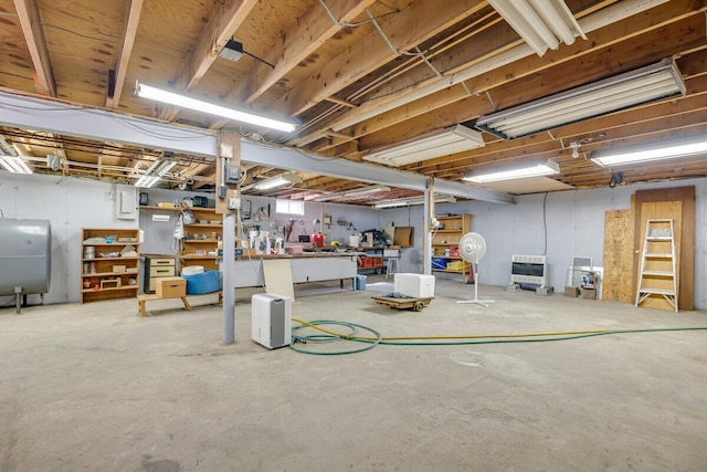148 Summit Ave, Pocono Summit, PA 18346 - below grade area featuring a workshop area, heating unit, and heating fuel