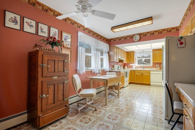 148 Summit Ave, Pocono Summit, PA 18346 - dining area with light floors, a ceiling fan, and a baseboard radiator