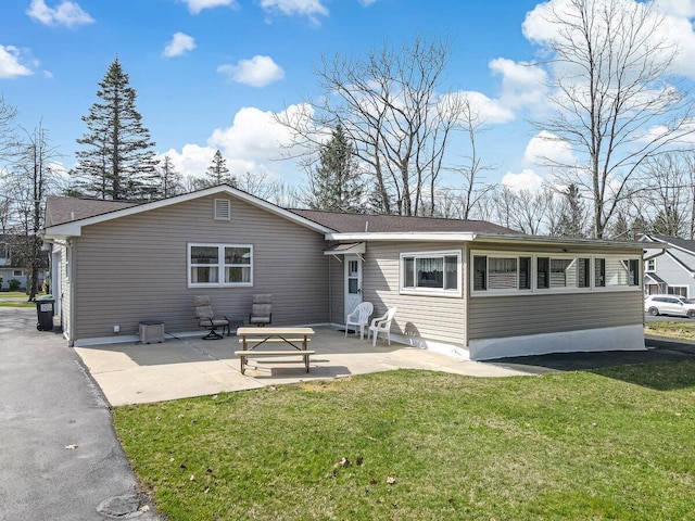 148 Summit Ave, Pocono Summit, PA 18346 - back of house with a patio area and a lawn