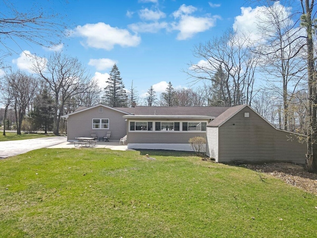 148 Summit Ave, Pocono Summit, PA 18346 - back of property with a patio and a lawn