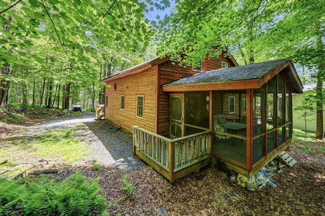 13 Sheffick Rd, Clifton Township, PA 18424 - view of home's exterior with a sunroom and roof with shingles